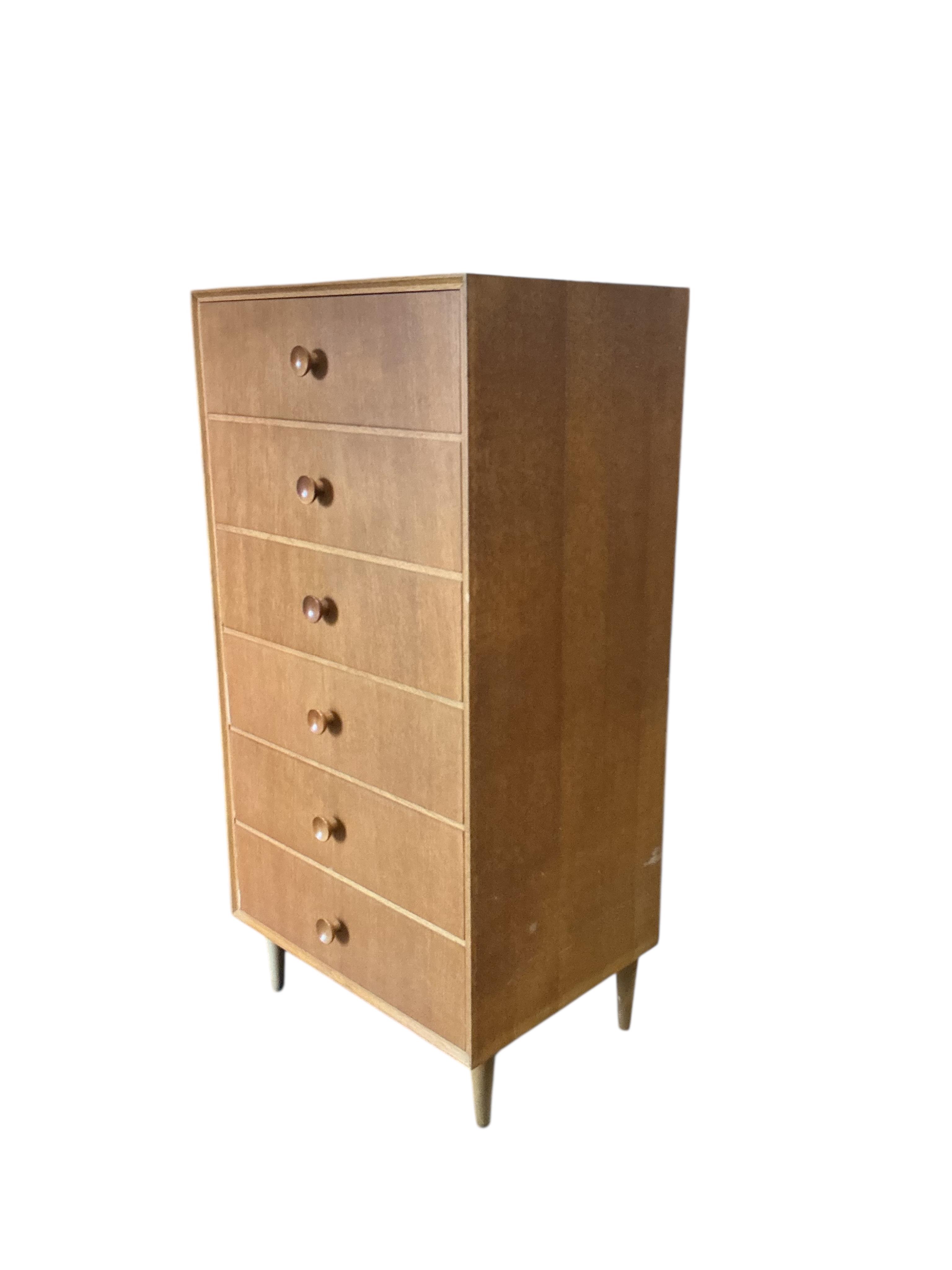 A mid century oak six drawer chest, width 61cm, depth 46cm, height 124cm